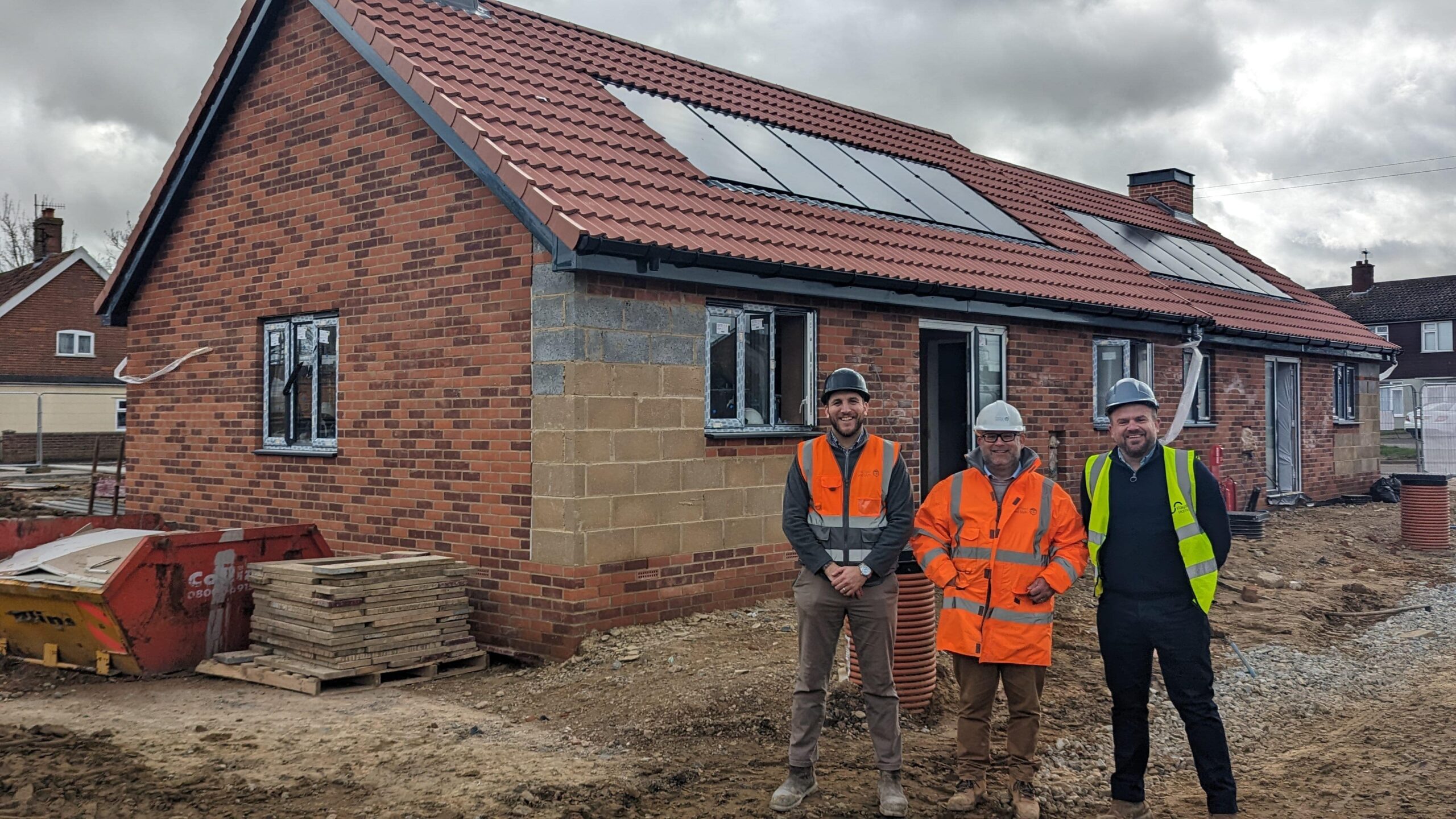 Kyle Crush and Tim Cooper (Marfleet and Blyth) with James Ollington (Flagship Homes) outside one of the South Close bungalows